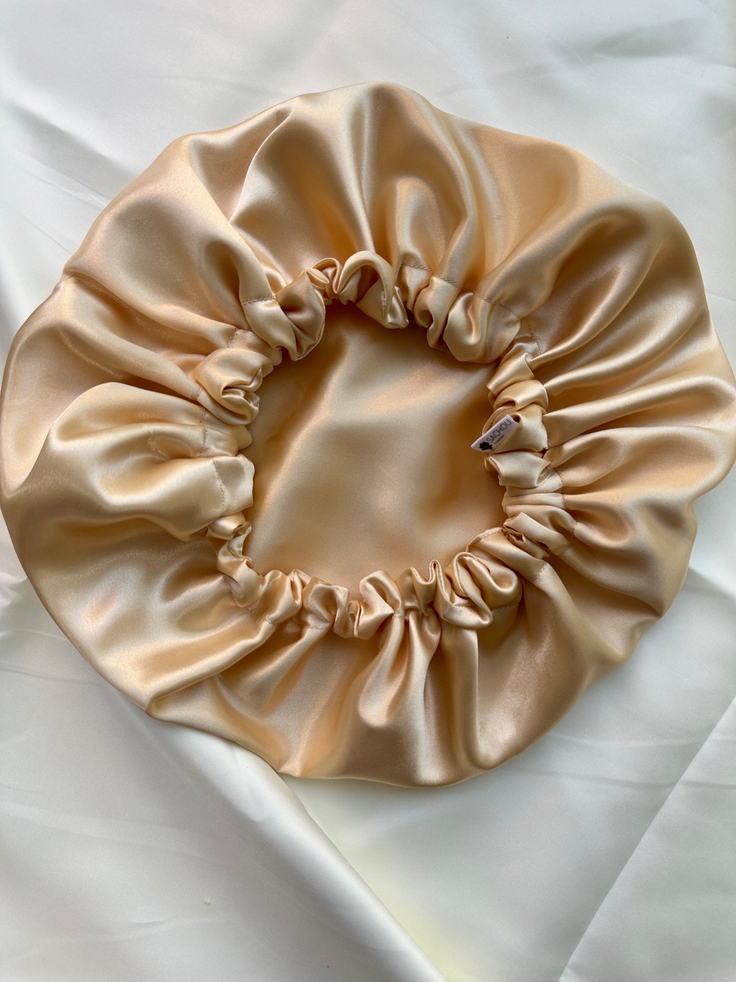 Bonnet en satin réversible